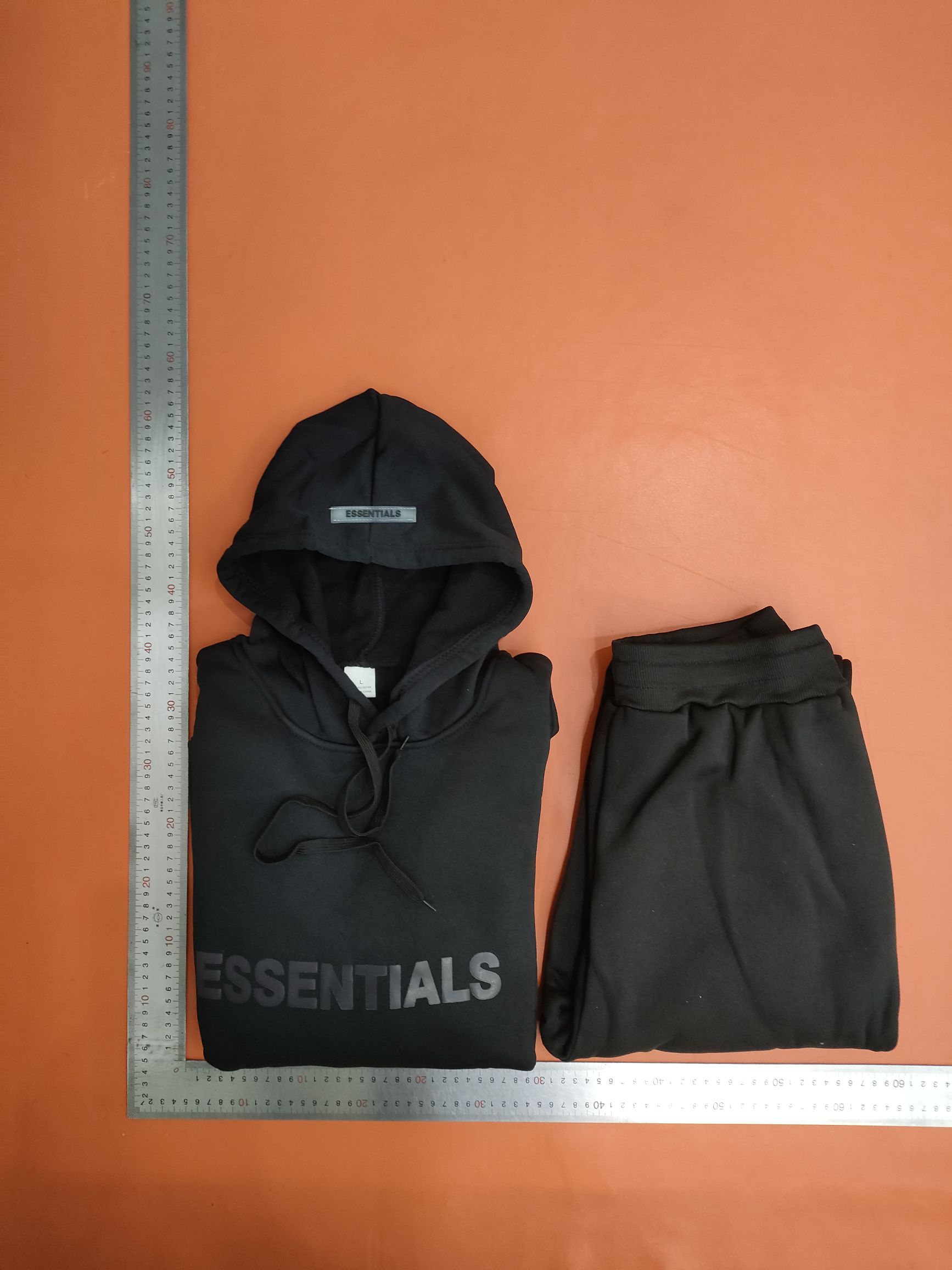 FEAR OF GOD EssenTIALS couples with two sets of tiaras for men and women in protective clothing